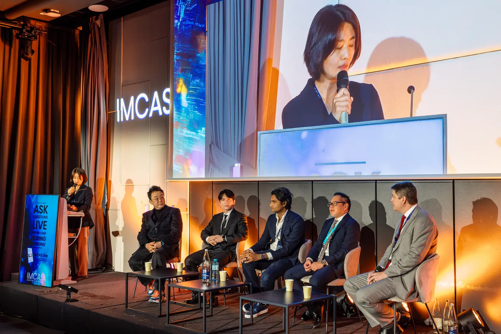 Participating physicians from several countries gathered around a live procedure at the IMCAS 2026 workshop