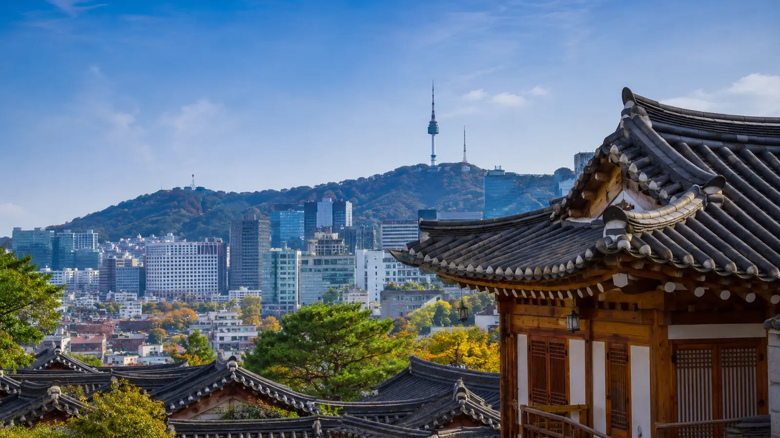 Seoul skyline with N Seoul Tower seen beyond the tiled roofs of Bukchon
